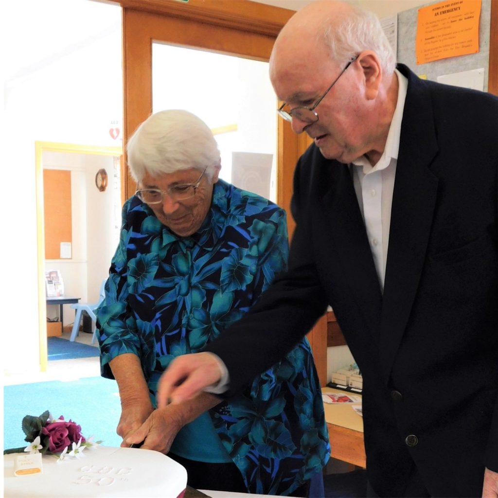 Heather and Murray Hall, cutting cake CBC 50th Anniv,